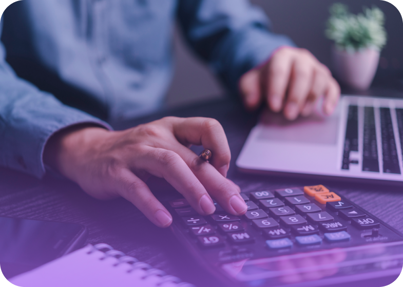 Calculator and laptop on desk